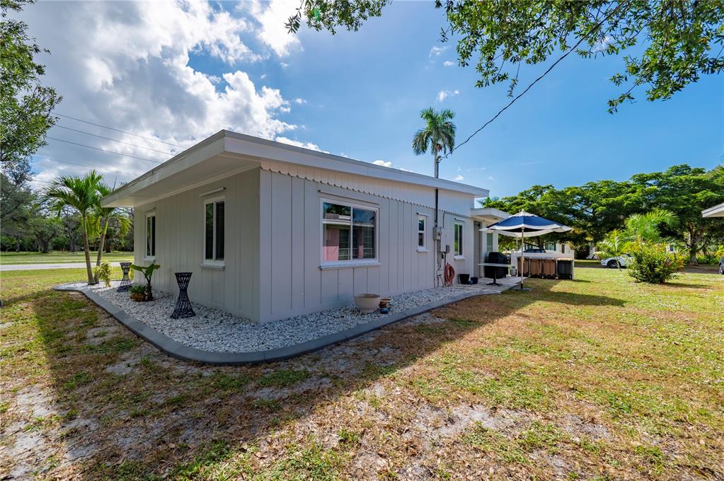 624 West Virginia Avenue Punta Gorda, FL 33950 - Photo 19 of 45 a view of a house with backyard porch and sitting area