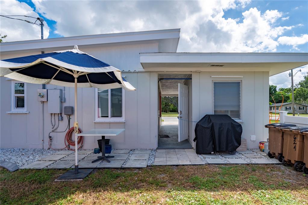 624 West Virginia Avenue Punta Gorda, FL 33950 - Photo 20 of 45 a front view of a house with a yard