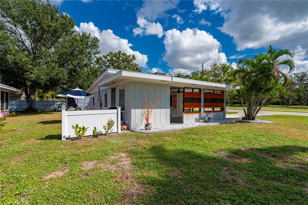 624 West Virginia Avenue Punta Gorda, FL 33950 - Photo 22 of 45 a white house with a big yard and large trees