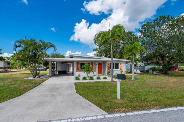 a bedroom with a bed and a television