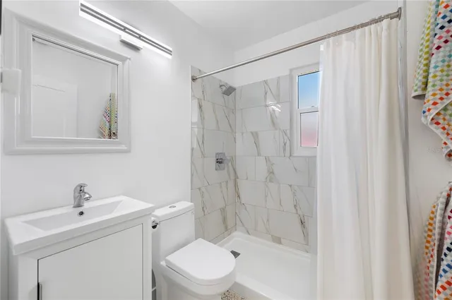 a view of a livingroom with furniture and windows