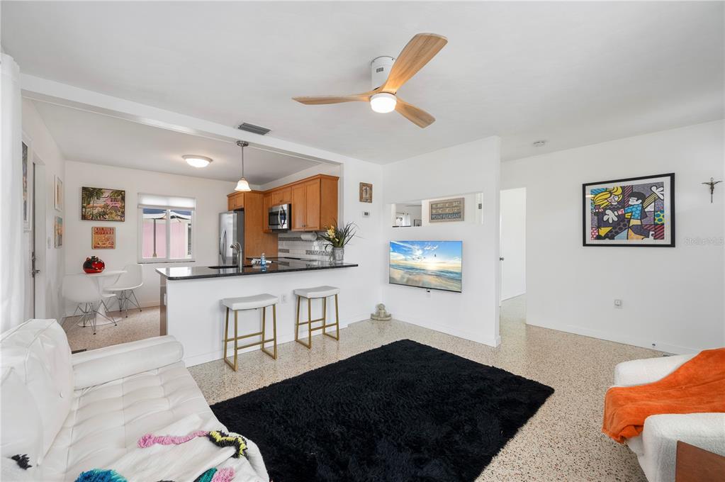 624 West Virginia Avenue Punta Gorda, FL 33950 - Photo 37 of 45 a kitchen with stainless steel appliances cabinets and wooden floor
