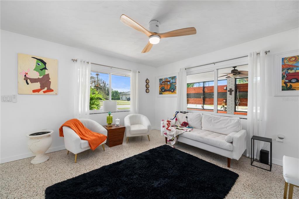 624 West Virginia Avenue Punta Gorda, FL 33950 - Photo 39 of 45 a living room with furniture ceiling fan and a rug