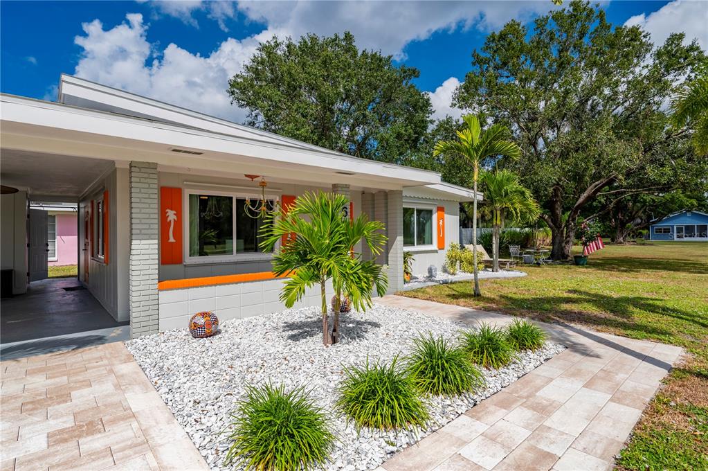 624 West Virginia Avenue Punta Gorda, FL 33950 - Photo 4 of 45 a view of a house with backyard patio and swimming pool