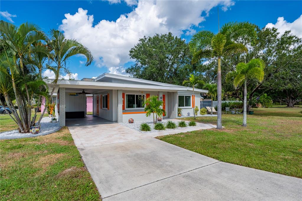 624 West Virginia Avenue Punta Gorda, FL 33950 - Photo 45 of 45 a view of a house with backyard porch and sitting area