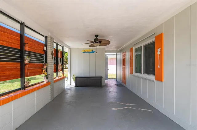 a view of an entryway with wooden floor and windows
