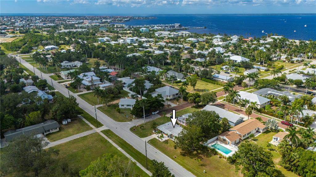 624 West Virginia Avenue Punta Gorda, FL 33950 - Photo 6 of 45 an aerial view of residential houses with outdoor space and trees