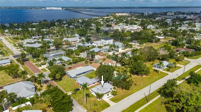 an aerial view of residential houses with outdoor space