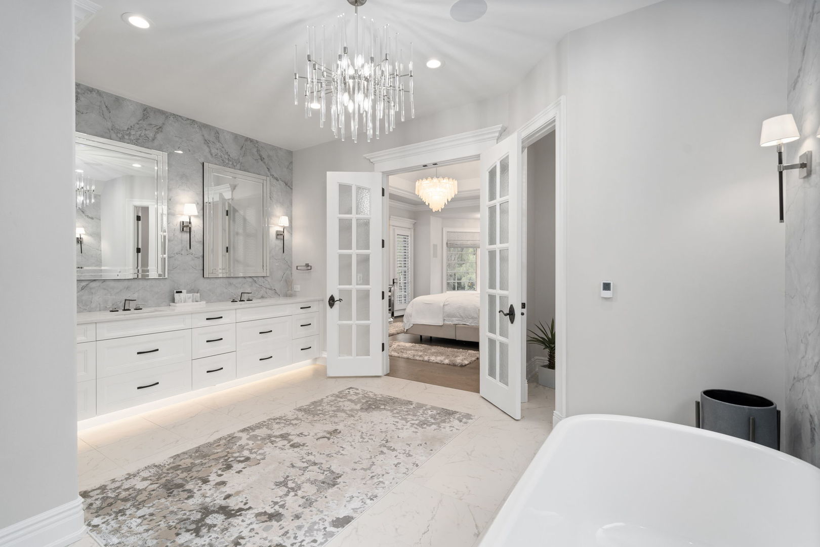 6403 South Garfield Street Burr Ridge, IL 60527 - Photo 24 of 95 a spacious bedroom with a bed a chandelier a mirror and shower