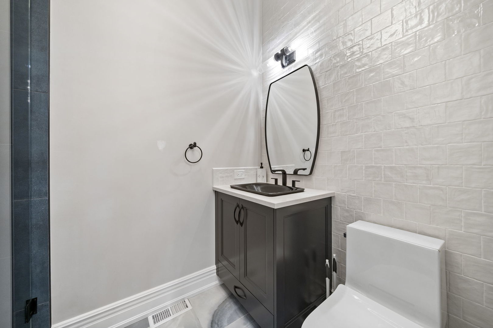 6403 South Garfield Street Burr Ridge, IL 60527 - Photo 34 of 95 a bathroom with a sink a toilet and a mirror