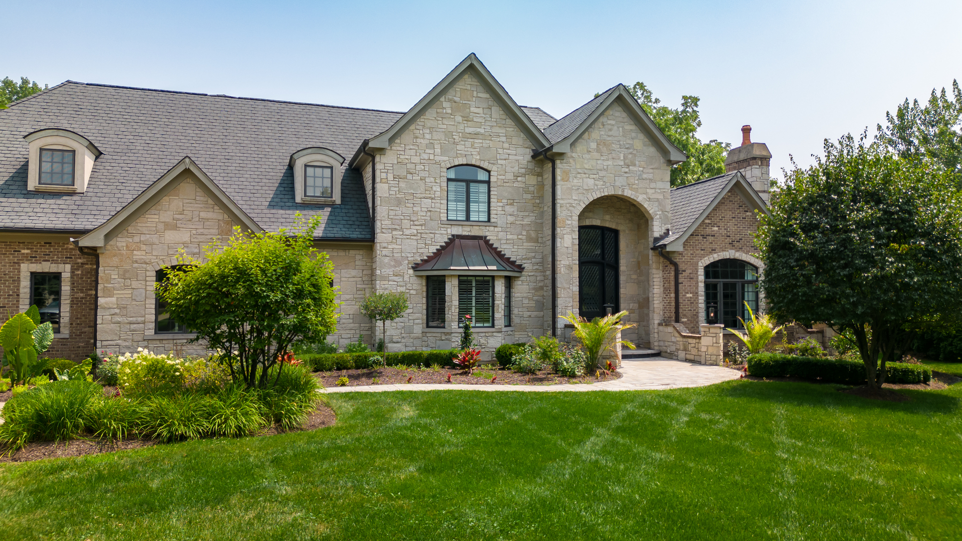 6403 South Garfield Street Burr Ridge, IL 60527 - Photo 5 of 95 a front view of a house with a garden