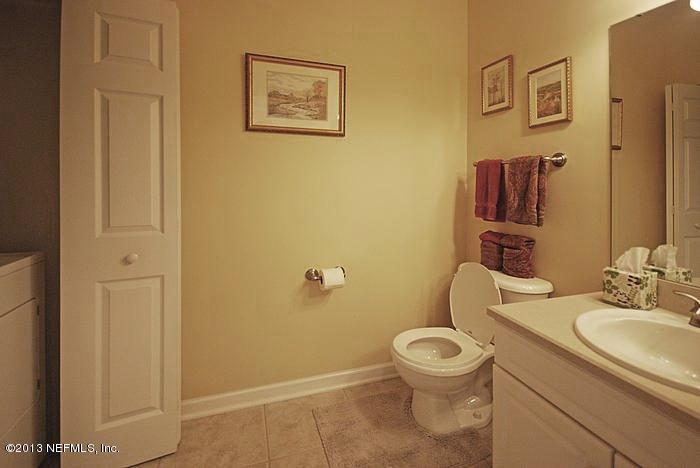 3117 Haley Pointe Road, Unit 3117 St. Augustine, FL 32084 - Photo 11 of 23 a bathroom with a toilet sink and mirror