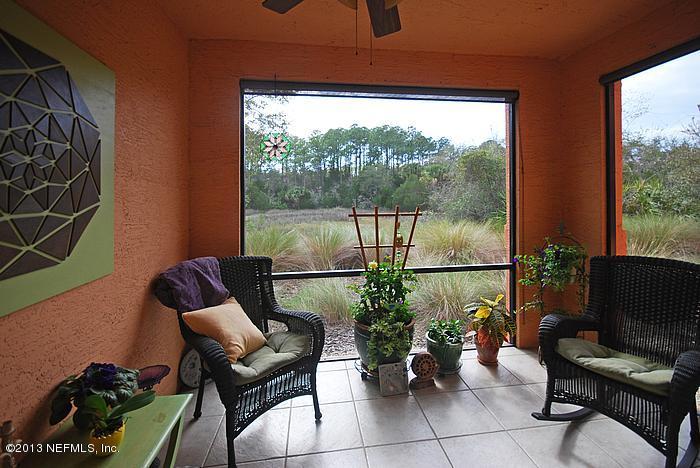 3117 Haley Pointe Road, Unit 3117 St. Augustine, FL 32084 - Photo 12 of 23 a living room with furniture and a potted plant