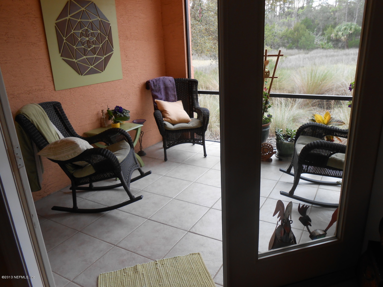 3117 Haley Pointe Road, Unit 3117 St. Augustine, FL 32084 - Photo 13 of 23 a living room with couches and a painting on the wall