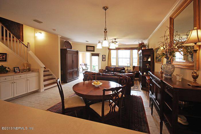 3117 Haley Pointe Road, Unit 3117 St. Augustine, FL 32084 - Photo 4 of 23 a view of a dining room with furniture and wooden floor