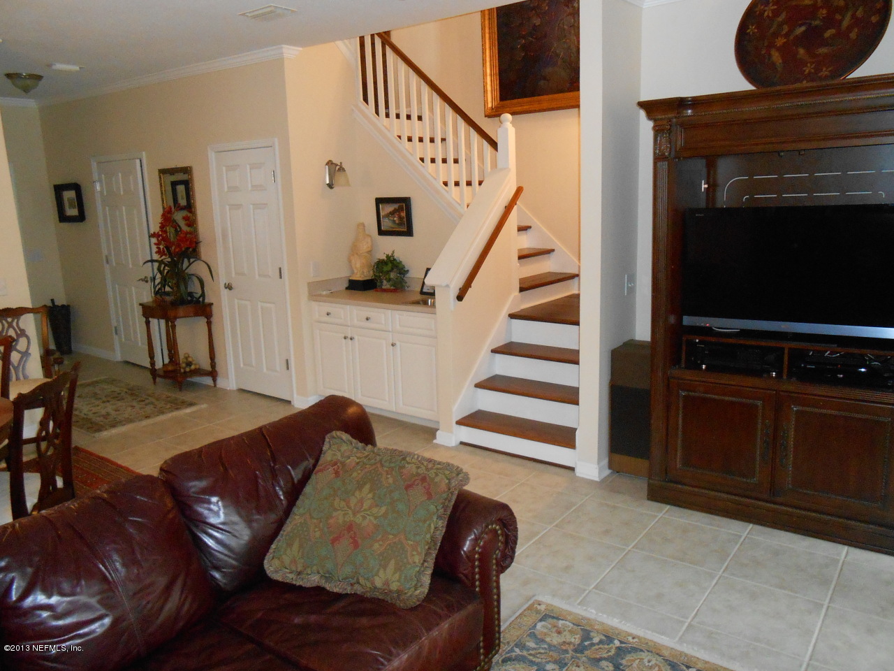 3117 Haley Pointe Road, Unit 3117 St. Augustine, FL 32084 - Photo 6 of 23 a living room with furniture and a flat screen tv