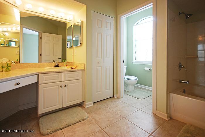 3117 Haley Pointe Road, Unit 3117 St. Augustine, FL 32084 - Photo 8 of 23 a spacious bathroom with a granite countertop sink a toilet and shower