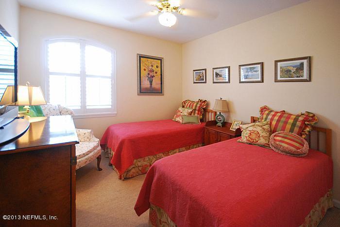 3117 Haley Pointe Road, Unit 3117 St. Augustine, FL 32084 - Photo 10 of 23 a bedroom with two beds and a window