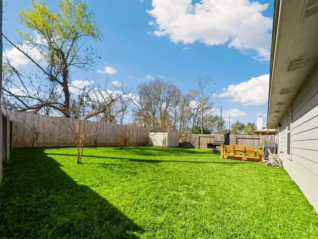 a view of a park with large trees