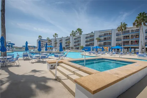 a view of swimming pool with outdoor seating