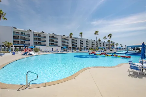 a kitchen with stainless steel appliances kitchen island granite countertop a sink and cabinets