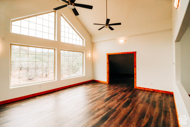 985 Russell Road Hatch, UT 84735 - Photo 14 of 30 Spare room featuring high vaulted ceiling, ceiling fan, and dark wood-style floors