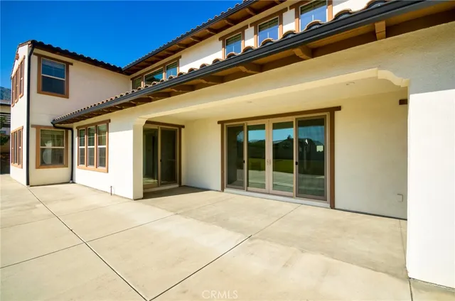 a view of a building with lake view and mountain view