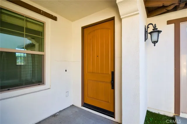 a view of an empty room with a fireplace