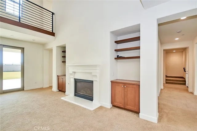 a large kitchen with stainless steel appliances kitchen island granite countertop a refrigerator and a stove top oven