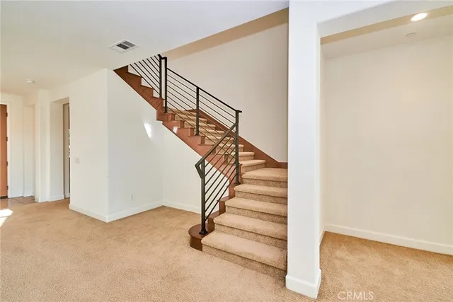 a view of staircase with lots of wooden floor and windows