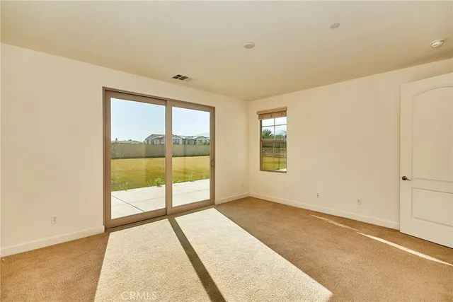 a spacious bathroom with a granite countertop sink and a mirror