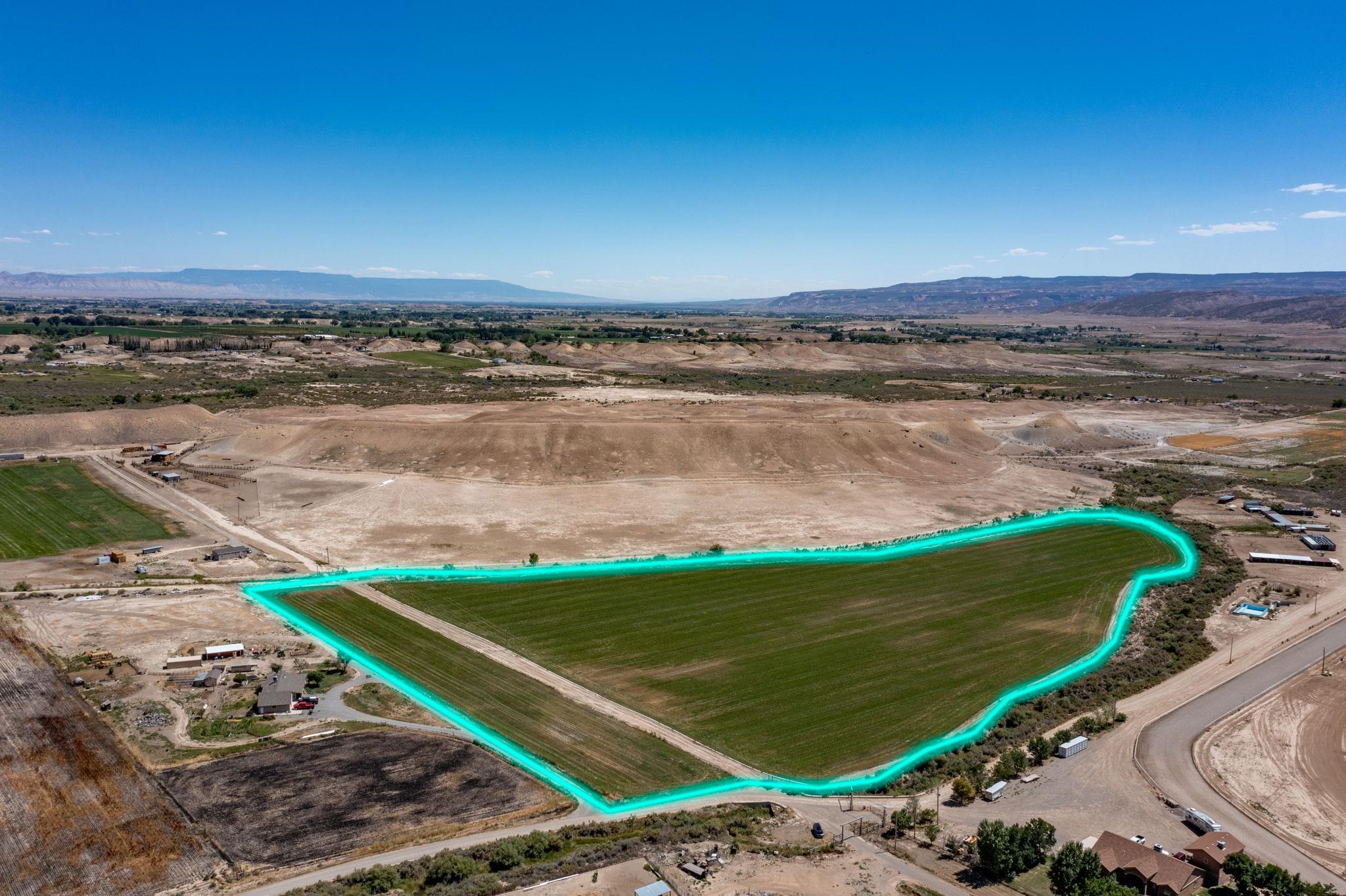 857 R Road Mack, CO 81525 - Photo 2 of 10 a view of a lake with a yard