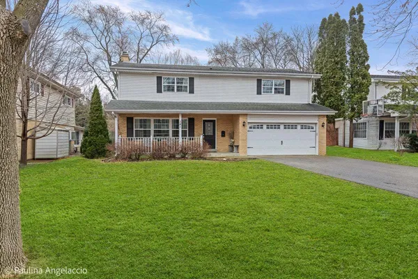 front view of a house with a yard