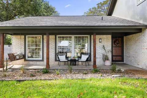 a backyard of a house with yard fire pit and outdoor seating
