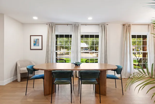 a workspace with furniture window and wooden floor