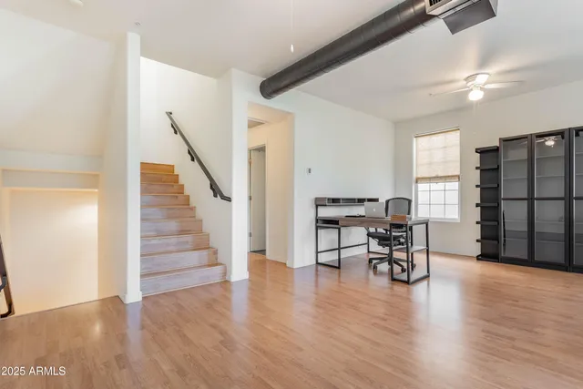 a view of a livingroom with furniture and wooden floor