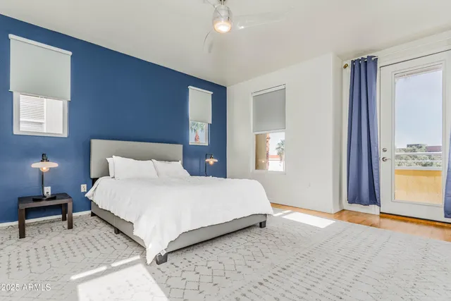 a bedroom with a bed and a lamp