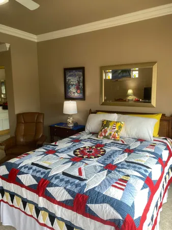 a bedroom with a bed and a table