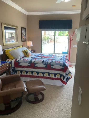 a bed room with furniture and a window