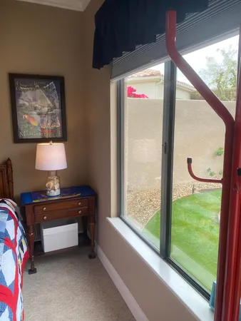 a bed room with a bed and a window