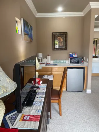 a living room with furniture and a rug