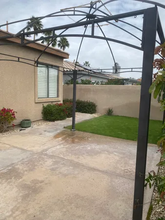 a house with a garden and lake view