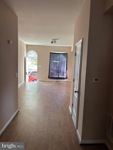 a kitchen with granite countertop wooden cabinets and stainless steel appliances