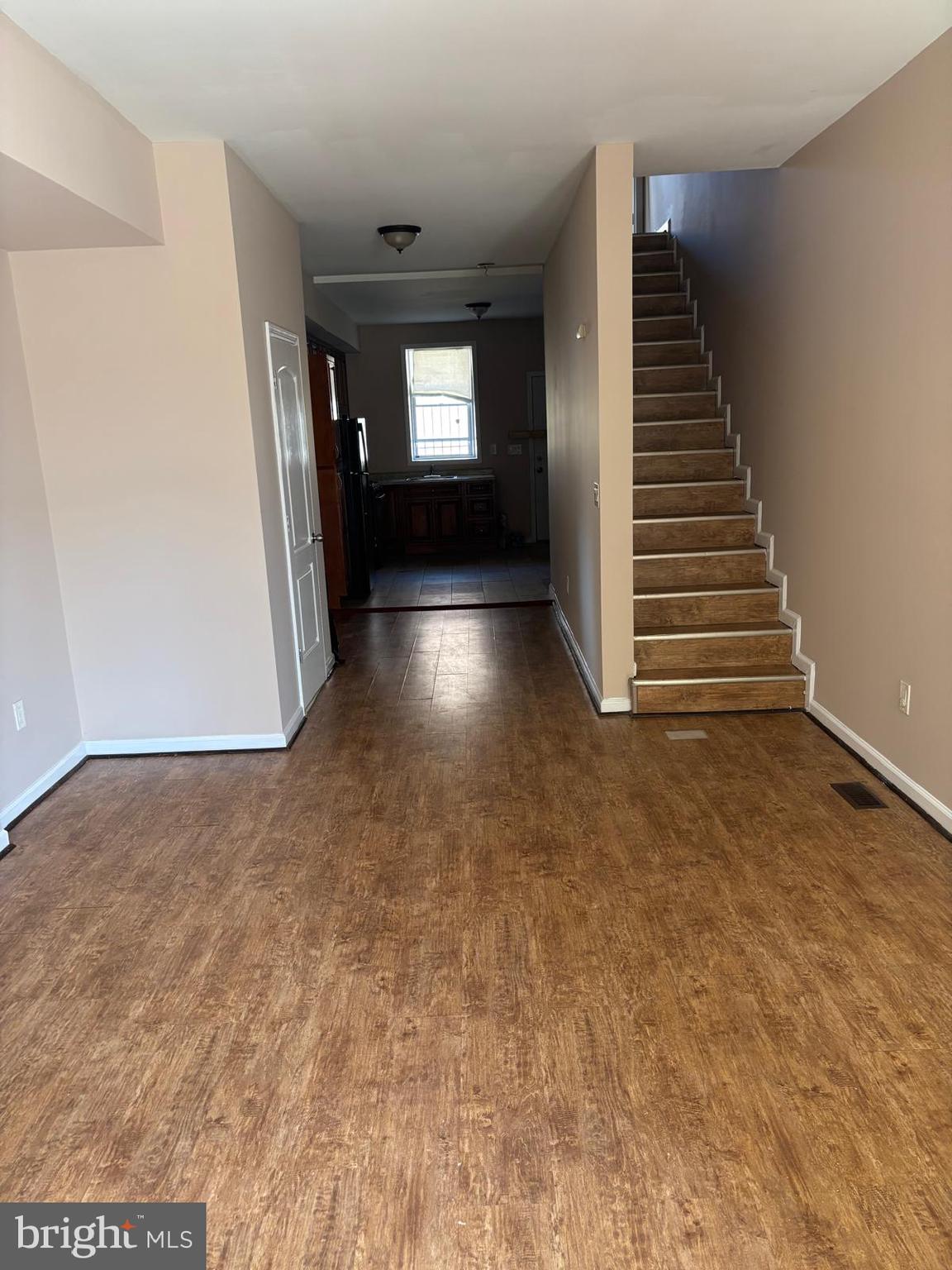 2328 East Madison Street Baltimore, MD 21205 - Photo 8 of 10 a view of wooden floor and windows in a room