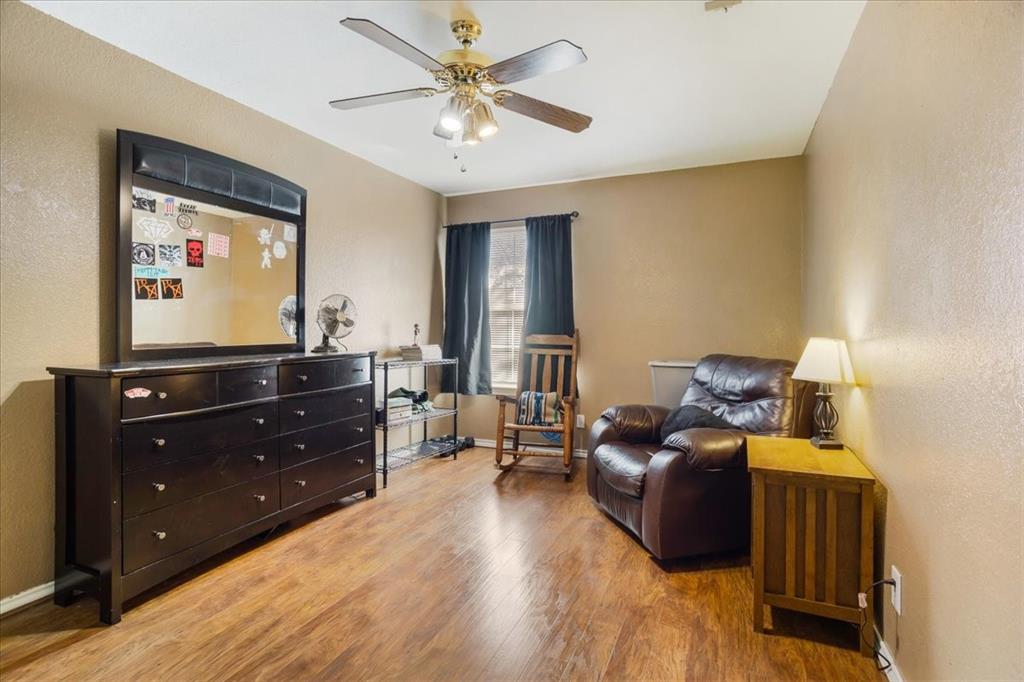 227 North Hopson Street Van Alstyne, TX 75495 - Photo 17 of 38 a living room with furniture and wooden floor