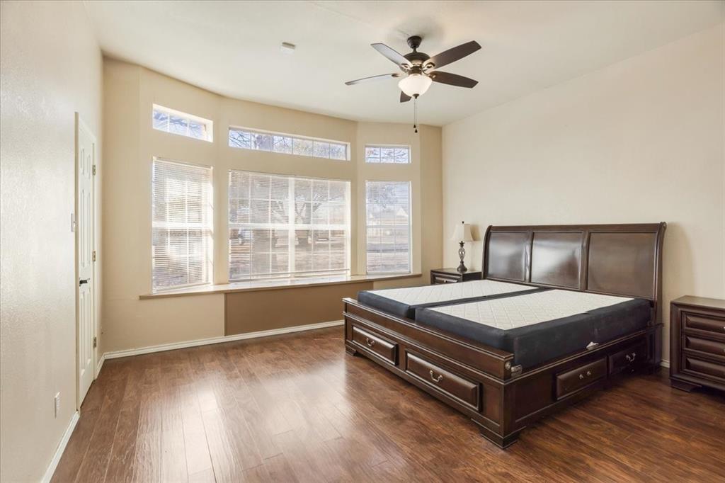 227 North Hopson Street Van Alstyne, TX 75495 - Photo 19 of 38 a bedroom with a bed and window
