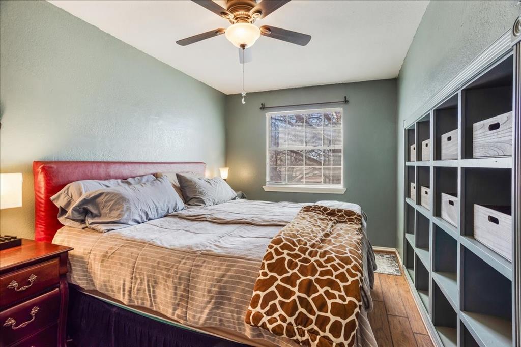 227 North Hopson Street Van Alstyne, TX 75495 - Photo 28 of 38 a bedroom with a bed and a window