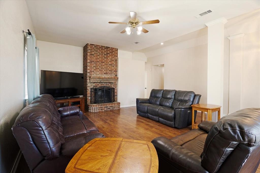 227 North Hopson Street Van Alstyne, TX 75495 - Photo 3 of 38 a living room with furniture and a flat screen tv