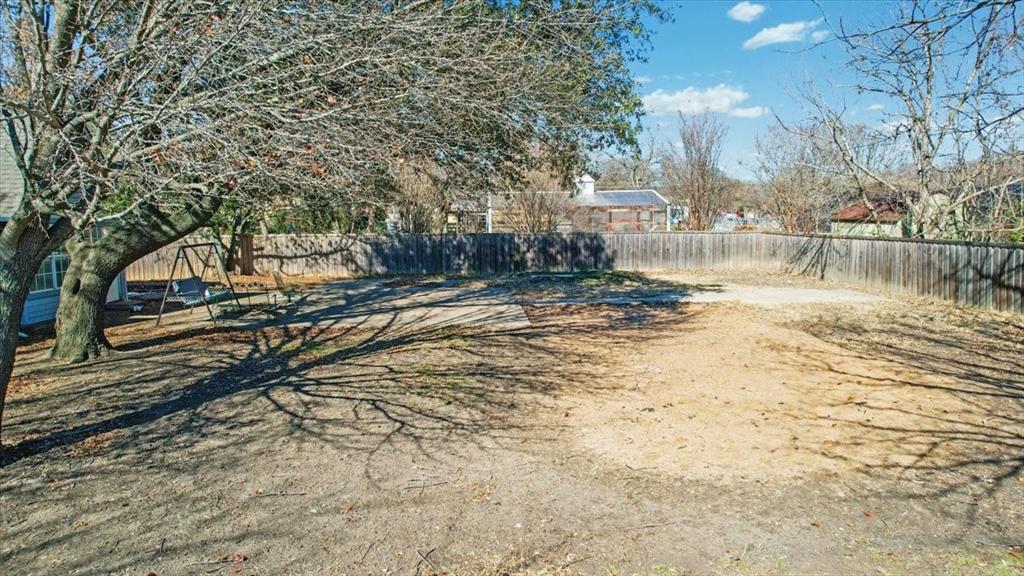 227 North Hopson Street Van Alstyne, TX 75495 - Photo 36 of 38 a view of a yard with large trees