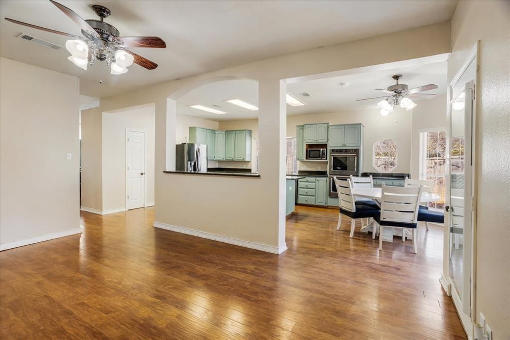 227 North Hopson Street Van Alstyne, TX 75495 - Photo 6 of 38 a view of a living room and kitchen view